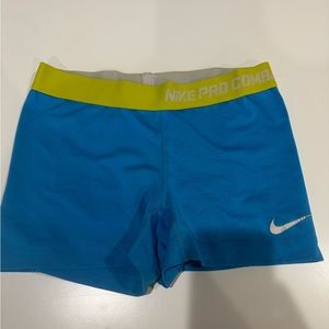 Blue Nike pros with neon green band
